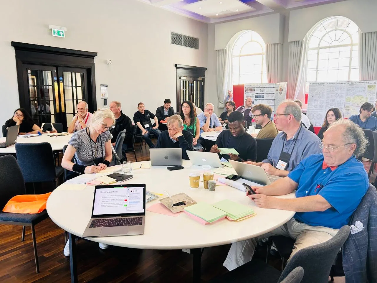 Participants seated around a table during a workshop session